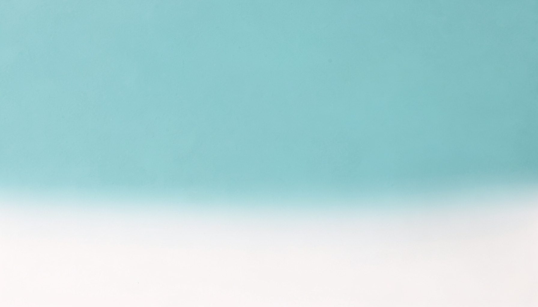 Muted turquoise block fading into a soft white lower half, evoking a calm editorial mood