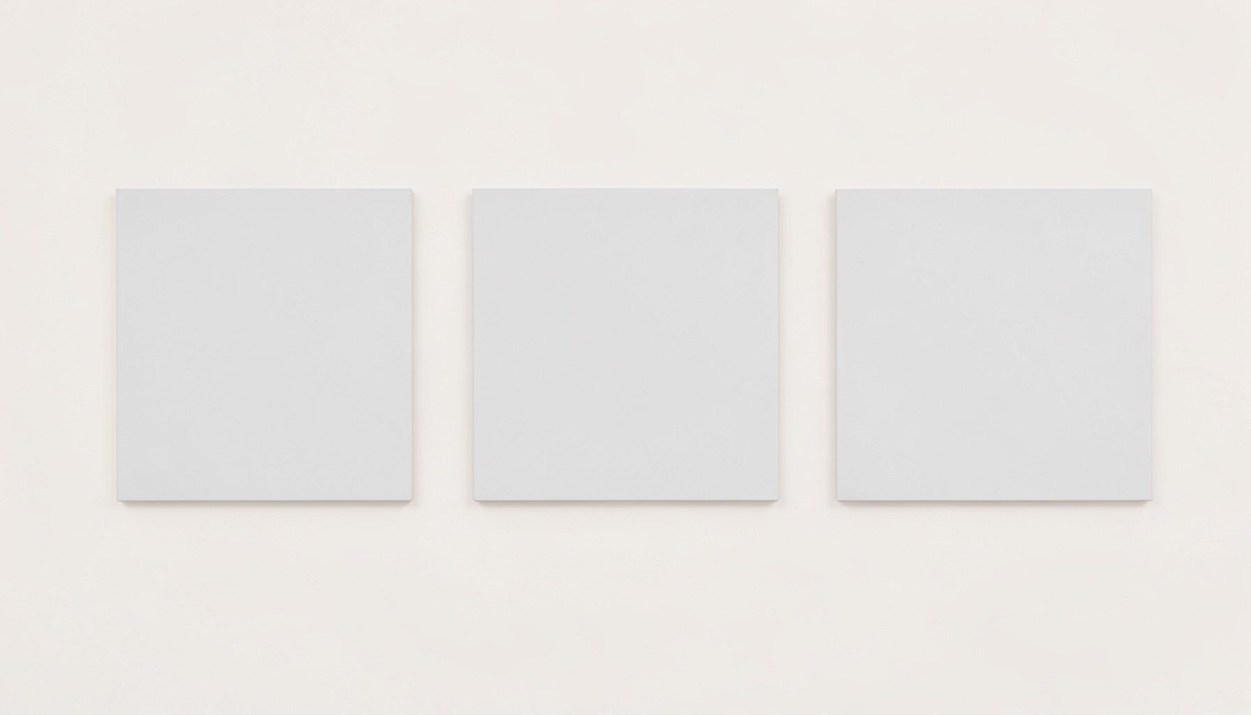 Soft pale background with three evenly spaced rectangular cards in light grey, suggesting a simple review layout