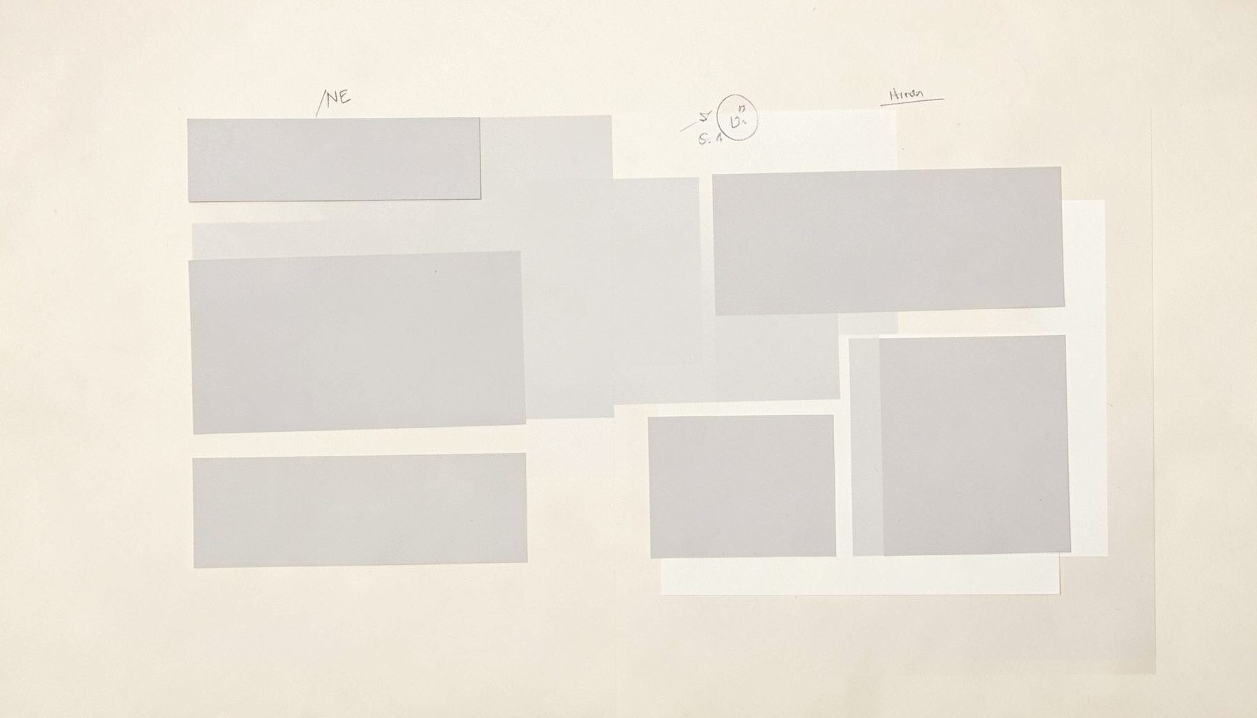 Abstract document layout with grey placeholder rectangles arranged on a soft cream surface, suggesting editorial review